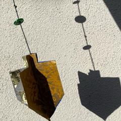 paper decorations shaped like dreidels