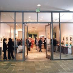 Ruby Commons  with people milling around looking at artwork on the walls