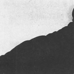 Black and white photo of dancer Valeska Gert posing as a clown.