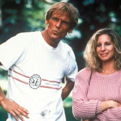 Still from the movie showing Nick Nolte and Barbara Streisand standing side-by-side looking towards the camera in a park