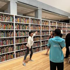 Vicki Phung Smith leads a tour of The American Library.