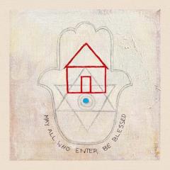 Painting of an outline of a house in red sits in the middle of a Hamsa alongside a pencil drawing of the Star of David. Below the Hamsa outline are the words, May All Who Enter Be Blessed. The canvass and paint strokes can be seen in various shades of cream and yellow.