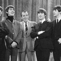 Ed Sulivan poses with the Beatles for his show.