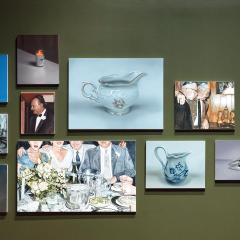 A group of painting hung together in a gallery featuring everyday life and objects.