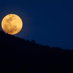 Full moon over the mountains.