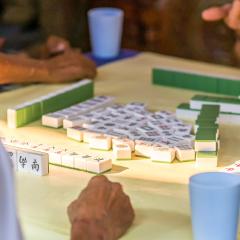 A game table set up with people around it.
