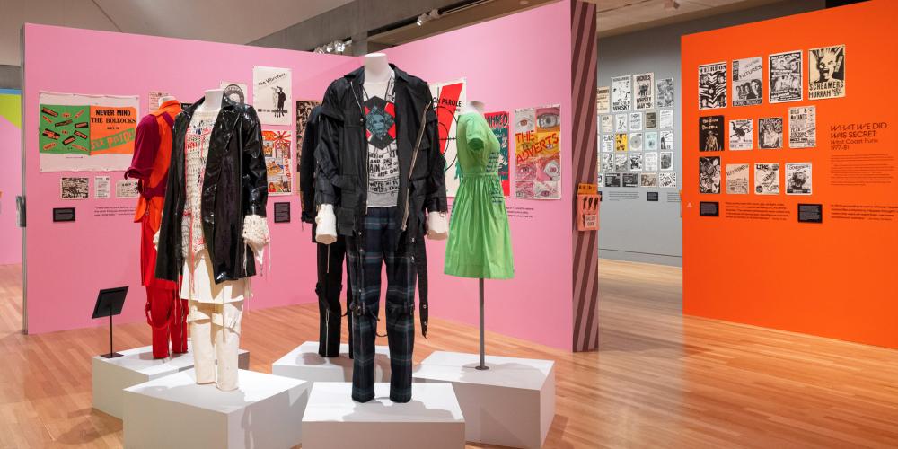 A gallery featuring colorful punk poster and clothing.